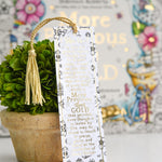 Decorative bookmark with tassel on a table with a colorful background
