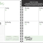 Spiral-bound planner with a weekly layout for September, featuring days of the week and prayer requests section.