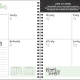 Spiral-bound planner with a weekly layout for September, featuring days of the week and prayer requests section.