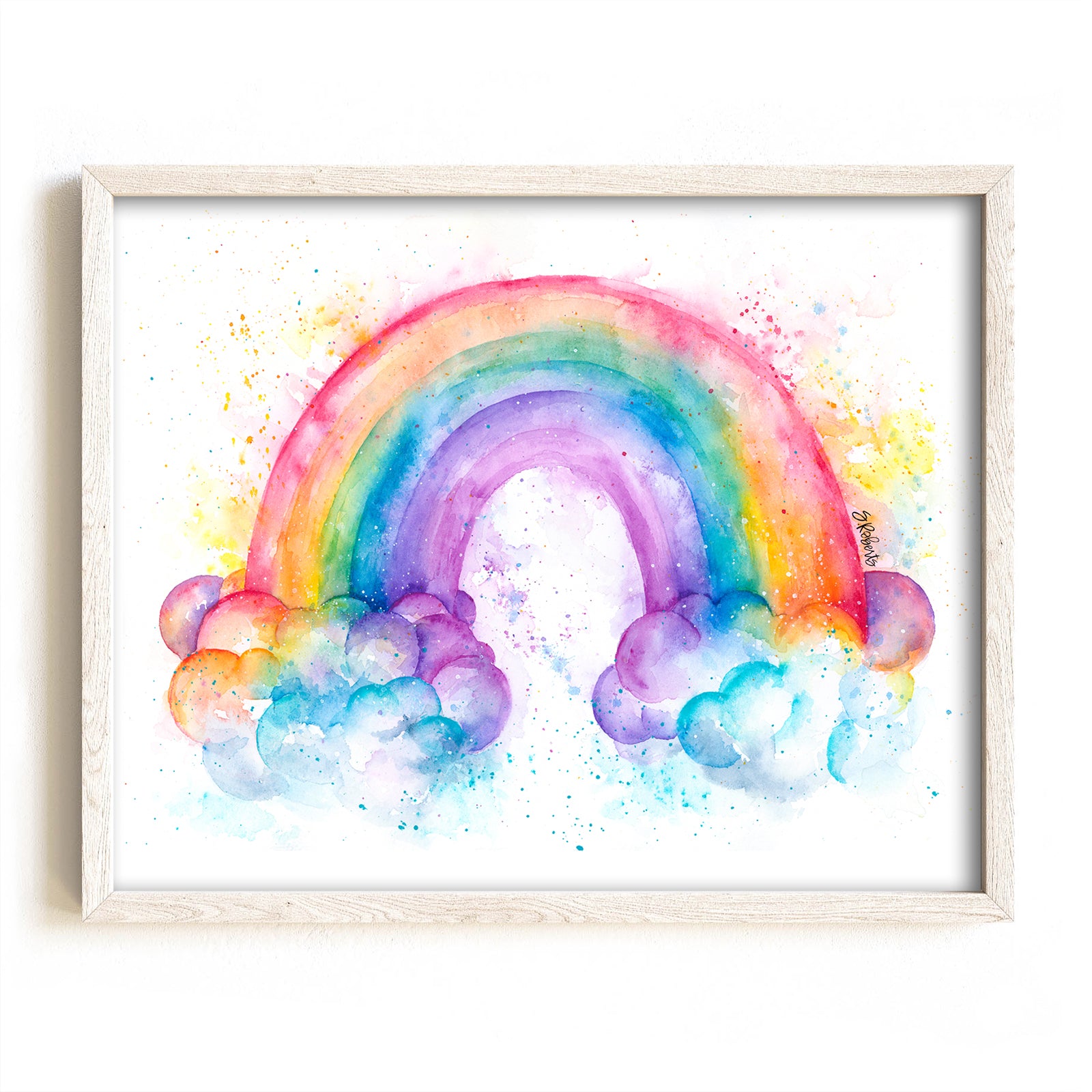 A colorful hand-painted watercolor art print of a rainbow with clouds, framed.
