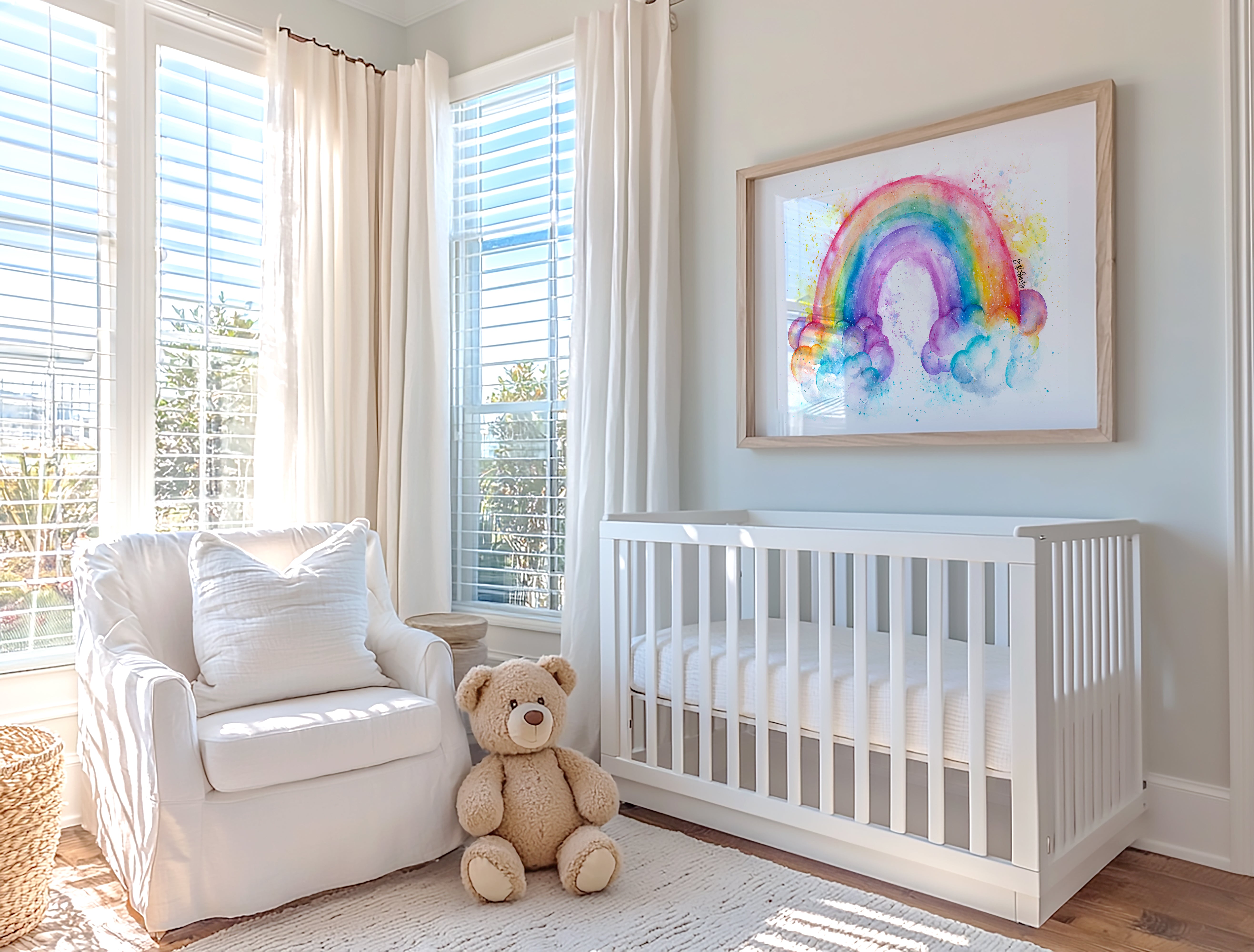 A nursery featuring a rainbow watercolor wall art print